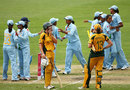 Lauren Ebsary and Rene Farrell wear a dejected look as the Indian team celebrates in the background, Australia v India, Super Six, women's World Cup, Sydney, March 14, 2009