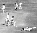 Chandu Borde leaps in the air as a catch is dropped of his bowling