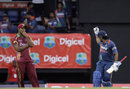 MS Dhoni signals to the pavilion after the victory while a dejected Ravi Rampaul looks on, West Indies v India, 3rd ODI, St Lucia, July 3, 2009