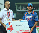 MS Dhoni is presented with the winning team's cheque, India v New Zealand, 2nd match, Compaq Cup, Colombo, September 11, 2009