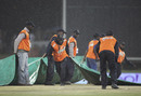 The groundstaff struggle to get the covers in place in the pouring rain, South Africa v Sri Lanka, Champions Trophy, Group B, Centurion, September 22, 2009