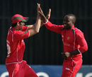 Prosper Utseya and Graeme Cremer celebrate a wicket, Zimbabwe v Kenya, 1st ODI, Harare, October 12, 2009