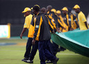 The covers were briefly removed but rain forced them back and  the match was abandoned without a ball being bowled, South Africa v England, 5th ODI, Durban, December 4, 2009 
