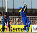 Tillakaratne Dilshan goes for a wild hit but is bowled by Harbhajan Singh, India v Sri Lanka, 1st ODI, Rajkot, December 15, 2009