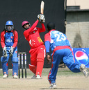 Pramodh Raja clubs a six down the ground, Singapore v USA, ICC World Cricket League Division Five, Lalitpur, February 24, 2010