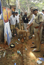 A policemen and a bomb-squad inspect the area around the Chinnaswamy Stadium, Royal Challengers Bangalore V Mumbai Indians, IPL, Bangalore, April 17, 2010