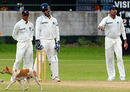 Rahul Dravid, MS Dhoni and VVS Laxman watch a dog walk across the ground, Sri Lanka Board President's XI v Indians, 3rd day, Colombo, July 15, 2010
