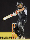 Kyle Mills cuts during his innings of 52, tri-series, 6th ODI, Dambulla, August 25, 2010