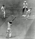 Les Favell cuts a ball Brian Statham as his team-mate Arthur Morris looks on, Australia v England, 3rd Test, MCG, 2nd day, January 1, 1955