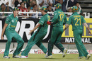 Morne Morkel's team-mates rush towards him after he held on to a catch from Yusuf Pathan, South Africa v India, 3rd ODI, Cape Town, January 18, 2011
