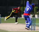 Rarva Dikana hits Rashard Marshall's stumps, Papua New Guinea v USA, WCL Division 3, Wong Nai, January 25, 2011