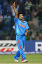 Piyush Chawla celebrates the wicket of Michael Clarke, India v Australia, World Cup warm-up match, Bangalore, February 13, 2011 