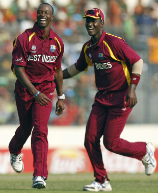 Kemar Roach and Darren Sammy blitzed Bangladesh's top order to set up a crushing nine-wicket win in Mirpur