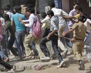 Police chase away fans who were unhappy at not obtaining tickets despite a long wait, Ahmedabad, March 21, 2010 Police chase away fans who were unhappy at not obtaining tickets despite a long wait, Ahmedabad, March 21, 2010