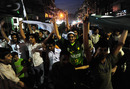 Fans in Islamabad wave flags in the street after Pakistan went through to the World Cup semi-finals, Islamabad, March 23, 2011  