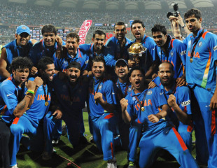 The Indian team celebrates after winning the World Cup in a hard-fought final in Mumbai