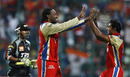 Chris Gayle and Abhimanyu Mithun celebrate the fall of Mithun Manhas, Royal Challengers Bangalore v Pune Warriors, IPL 2011, Bangalore, April 29, 2011