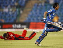 Yuzvendra Chahal celebrates after hitting the winnings runs, Mumbai Indians v Trinidad & Tobago, Champions League T20, Bangalore, 26 September, 2011