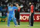 MS Dhoni talks to Graeme Swann while Craig Kieswetter looks on, India v England, 1st ODI, Hyderabad, October 14, 2011