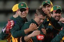 Xavier Doherty is embraced by team-mates, Tasmania v Victoria, Ryobi Cup, Hobart, Nov 2 2011