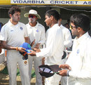 Sreesanth hands Sanju Samson his cap on his first-class debut, Vidarbha v Kerala, Ranji Trophy Plate League 2011-12, Nagpur, 1st day, November 3, 2011