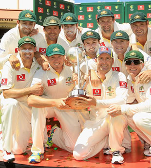 Australia with the Border-Gavaskar Trophy after completing a 4-0 sweep of India on the fifth morning in Adelaide