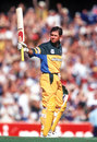 Ricky Ponting raises his bat after reaching his hundred, Australia v India, Calrton & United series, January 12, 2000 