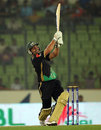 Kamran Akmal goes over the top during his 72, Duronto Rajshahi v Sylhet Royals, BPL, Mirpur, February 24, 2012