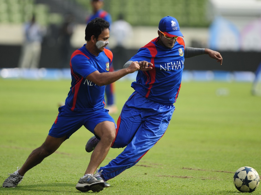 Shakib Al Hasan and Nazimuddin play football during a training session on the eve of the Asia Cup 