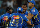 Team-mates congratulate Pragyan Ojha for a wicket, Pune Warriors v Mumbai Indians, IPL, Pune, May 3, 2012