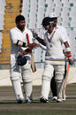 Karan Goel and Mandeep Singh walk off after securing victory, Punjab v Saurashtra, Ranji Trophy, Group A, Mohali, 3rd day, November 26, 2012