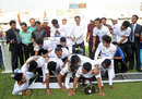 The victorious Central Zone team accidentally push down the placard and fall in a heap as they pose for the photographers, Central Zone v North Zone, BCL final, Mirpur, 4th day, February 25, 2013