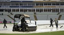 Groundsmen try to clear water from the pitch, Australia v New Zealand, Champions Trophy, Group A, Edgbaston, June 12, 2013