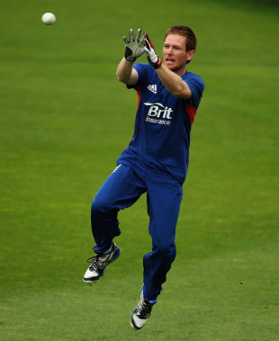 Eoin Morgan practices his catches on the eve of the Champions Trophy semi-final against South Africa at the Oval