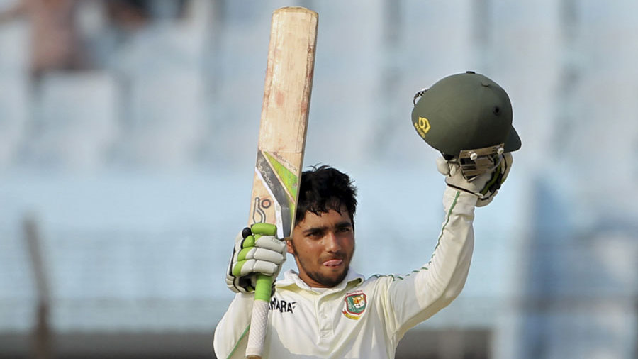 Mominul Haque raises his bat after reaching his third Test hundred Mominul Haque raises his bat after reaching his third Test hundred