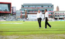 A wet outfield was the problem for umpires Marais Erasmus and Rod Tucker, England v India, 4th Test, Old Trafford, 2nd day, August 8, 2014 A wet outfield was the problem for umpires Marais Erasmus and Rod Tucker, England v India, 4th Test, Old Trafford, 2nd day, August 8, 2014