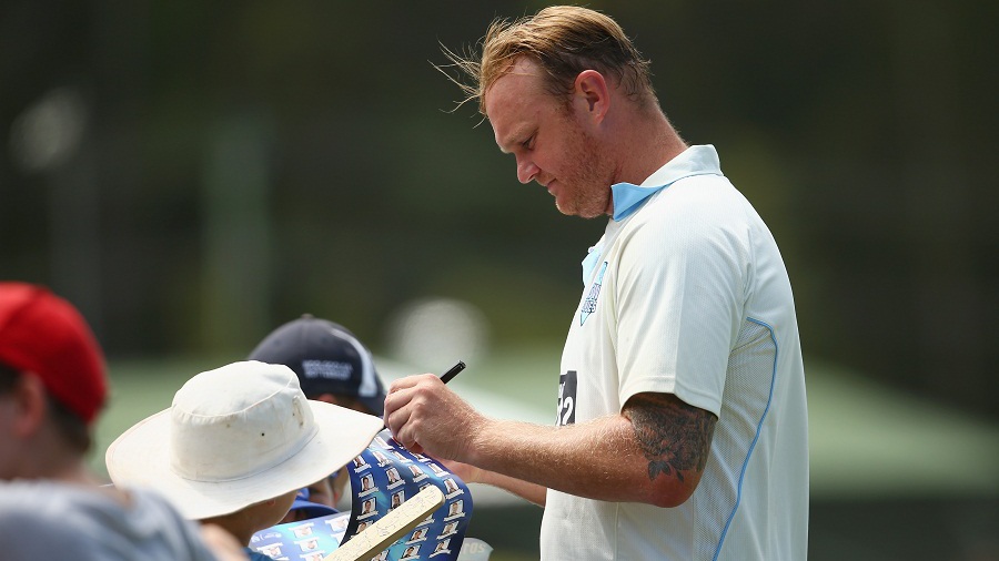 Doug Bollinger signs autographs for some spectators Doug Bollinger signs autographs for some spectators