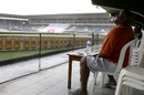 A fan watches the rain fall at Sabina Park, West Indies v India, 2nd Test, Kingston, 3rd day, August 1, 2016 A fan watches the rain fall at Sabina Park, West Indies v India, 2nd Test, Kingston, 3rd day, August 1, 2016