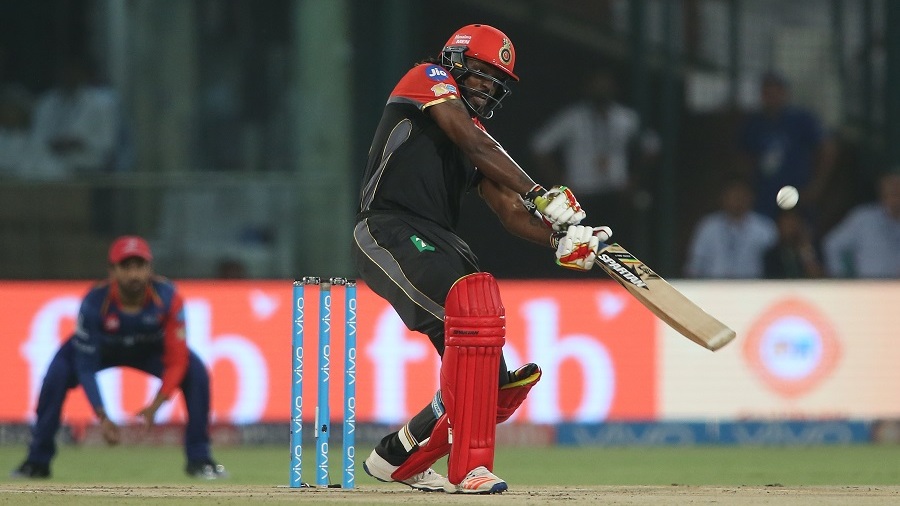 Chris Gayle throws his hands at the ball Chris Gayle throws his hands at the ball