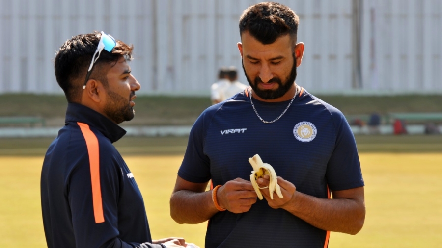Cheteshwar Pujara having a banana during a practice session Cheteshwar Pujara having a banana during a practice session
