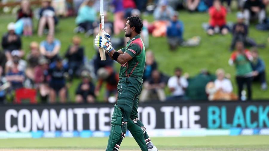 Sabbir Rahman gestures at his bat while celebrating his first international century Sabbir Rahman gestures at his bat while celebrating his first international century
