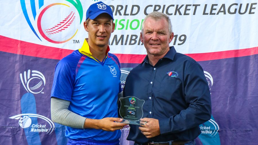 Namibia allrounder JJ Smit receives the Player of the Tournament award from former ICC board Associate representative Francois Erasmus Namibia allrounder JJ Smit receives the Player of the Tournament award from former ICC board Associate representative Francois Erasmus