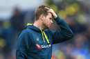 Warner finds form between showers