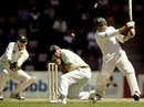 20 Nov 1999: Pakistan batsman Inzamam-ul-Haq blasts a drive past Australian fieldsman Justin Langer on his way to an unbeaten 116 runs during day three of the Second test between Australia and Pakistan at Bellerive Oval, Hobart, Australia. Pakistan finished the day 327 runs ahead of Australia with three wickets in hand.
