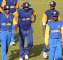 Russel Arnold leads Sri Lanka A off the field after sealing the series against West India A
