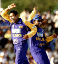 Tillakaratne Dilshan and Mahela Jayawardene do the celebratory jig at the fall of an Indian wicket at Dambulla, August 3, 2005