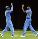 Rahul Dravid and Ashish Nehra celebrate a wicket, India v West Indies, Premadasa Stadium, August 7, 2005