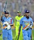 Suresh Raina and Mahendra Singh Dhoni return triumphant after clinching victory, Pakistan v India, 4th ODI, Multan, February 16 2006