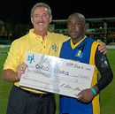 Allen Stanford hands Carlo Morris a cheque for $10,000, Anguilla v Barbados, Stanford 20/20, Antigua, July 18, 2006 