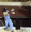 The bat flies off Mahendra Singh Dhoni's gloves while attempting a slog India Blue v India Green, Challenger Series, Chennai, October 2, 2006